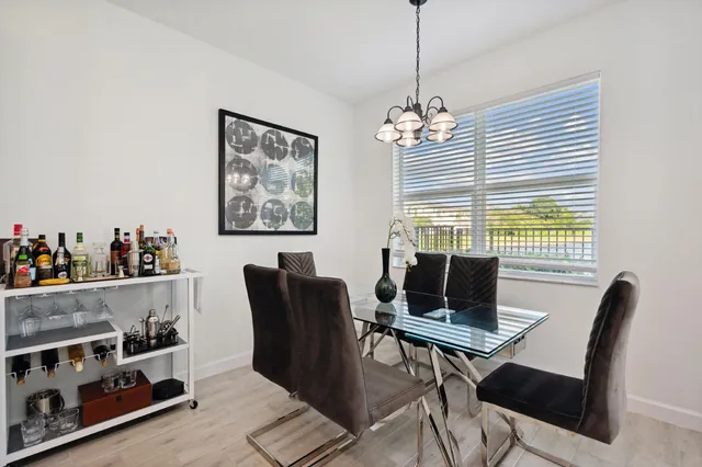 a view of a dining room with furniture and window