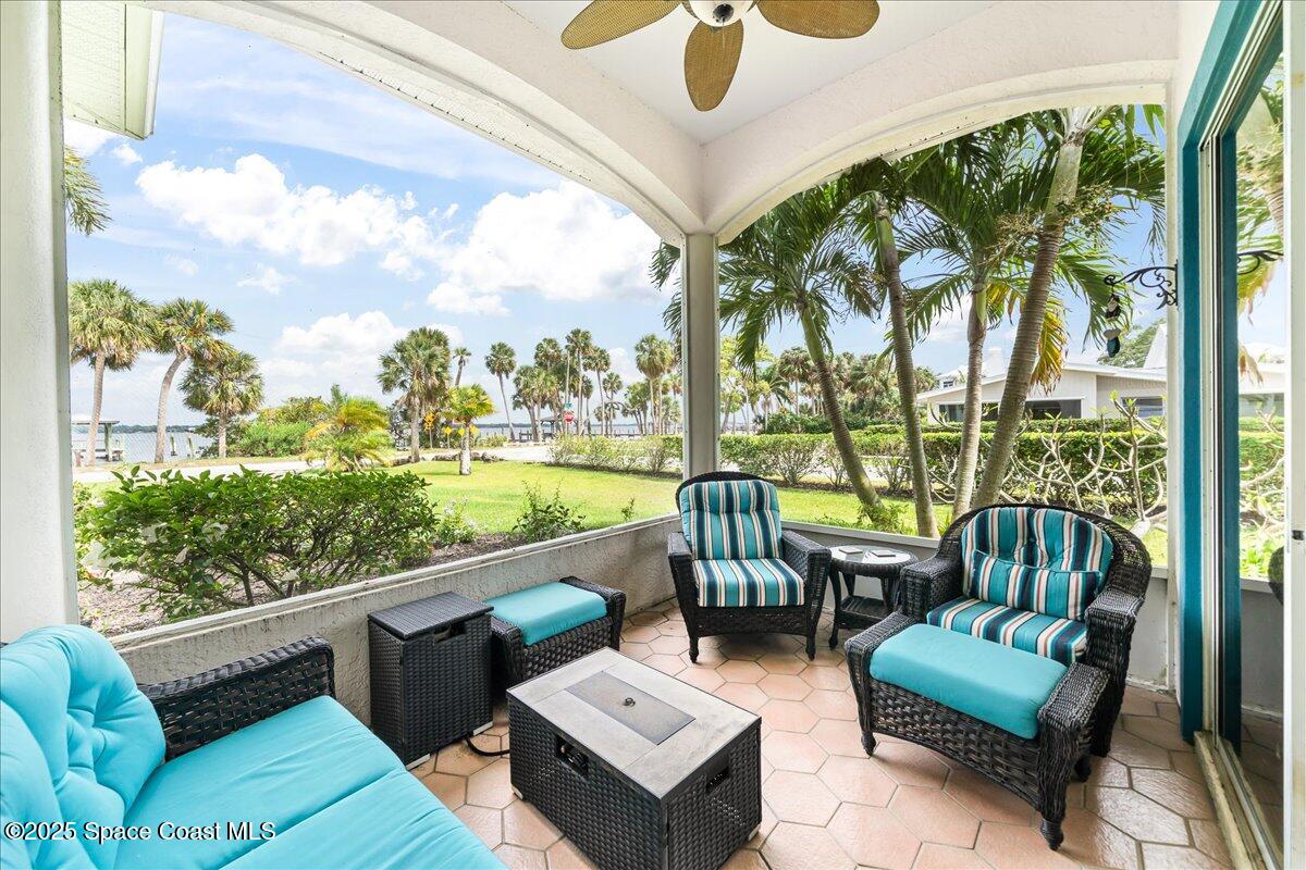 2089 Rockledge Drive Rockledge, FL 32955 - Photo 18 of 60 a balcony with furniture and a floor to ceiling window