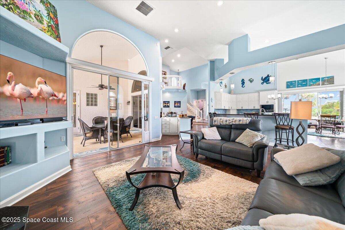 2089 Rockledge Drive Rockledge, FL 32955 - Photo 19 of 60 a living room with furniture a rug and a large window