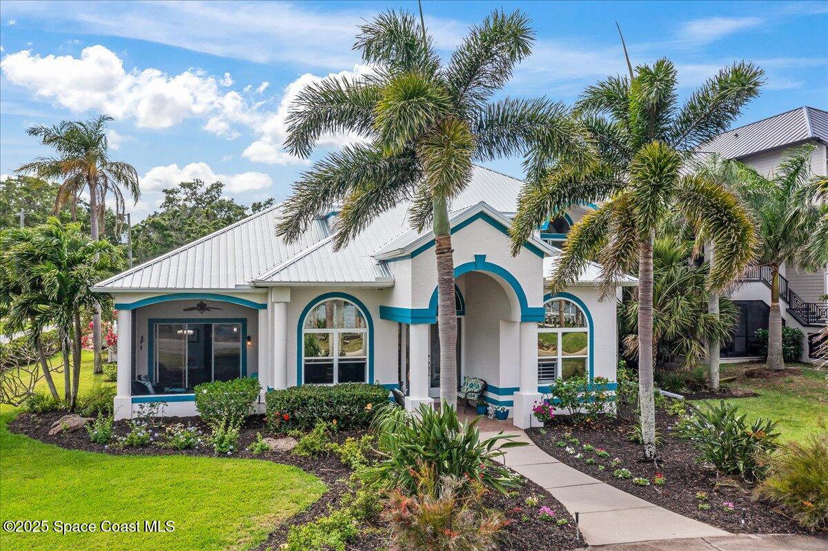 2089 Rockledge Drive Rockledge, FL 32955 - Photo 2 of 60 a front view of a house with garden