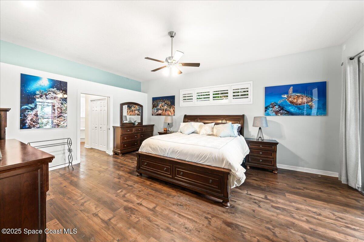 2089 Rockledge Drive Rockledge, FL 32955 - Photo 22 of 60 a bedroom with a bed and wooden floor