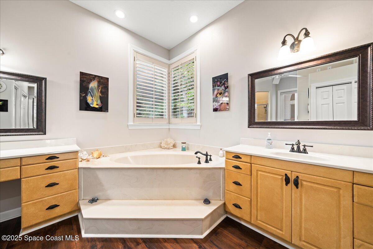 2089 Rockledge Drive Rockledge, FL 32955 - Photo 25 of 60 a bathroom with a double vanity sink mirror and bathtub