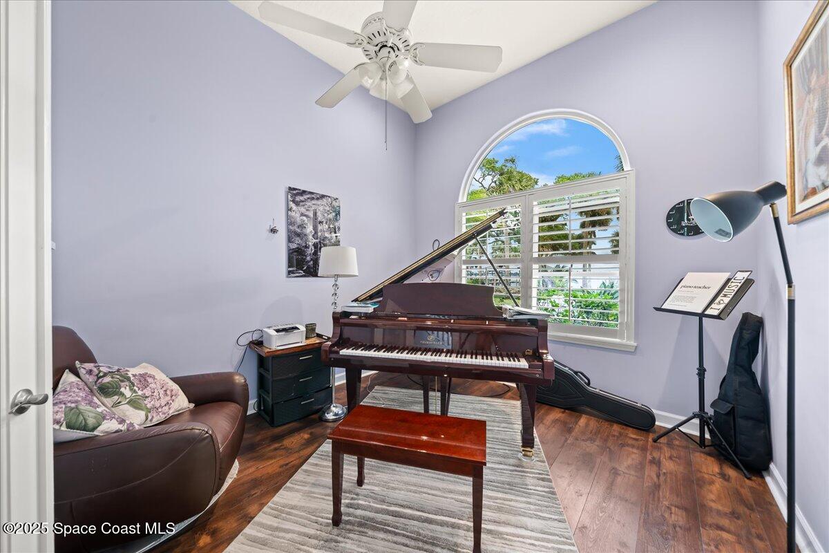 2089 Rockledge Drive Rockledge, FL 32955 - Photo 27 of 60 a living room with furniture and wooden floor