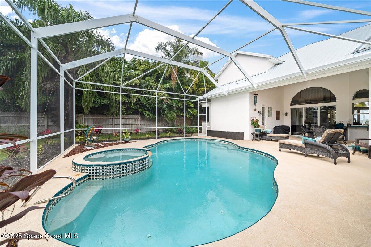 2089 Rockledge Drive Rockledge, FL 32955 - Photo 3 of 60 a view of a swimming pool with a patio and a garden