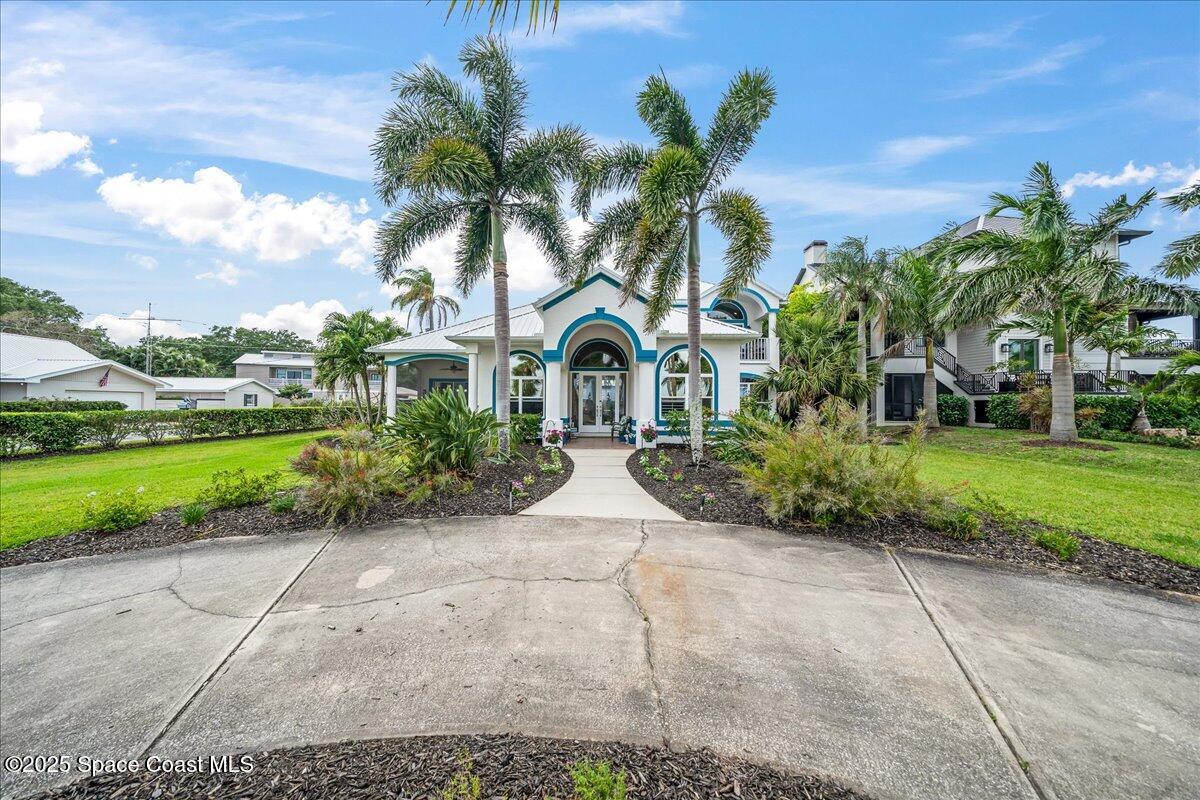 2089 Rockledge Drive Rockledge, FL 32955 - Photo 45 of 60 a house with garden in front of it