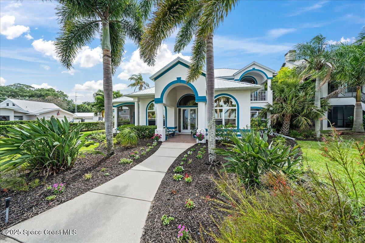 2089 Rockledge Drive Rockledge, FL 32955 - Photo 46 of 60 a front view of a house with garden