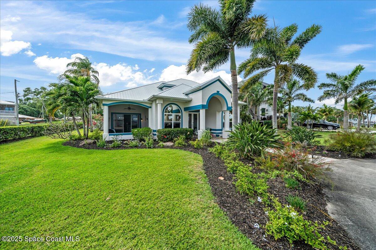 2089 Rockledge Drive Rockledge, FL 32955 - Photo 47 of 60 a front view of a house with yard and green space