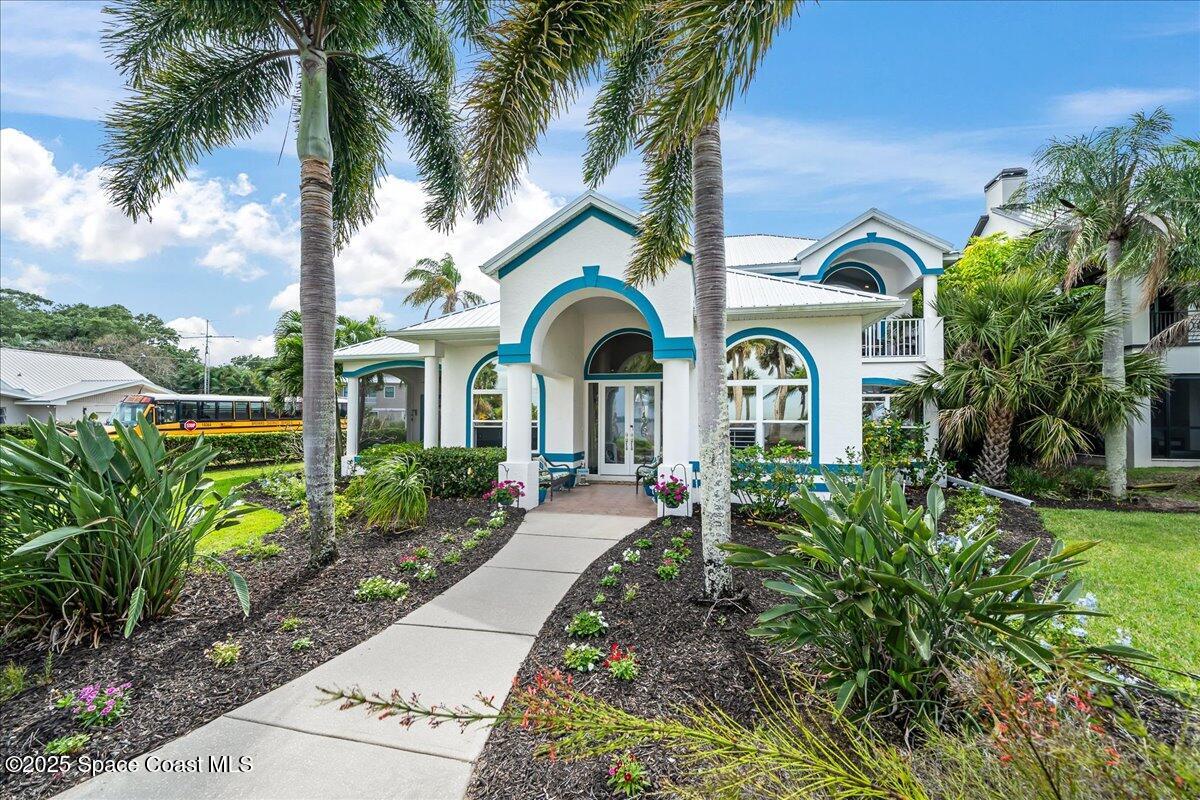 2089 Rockledge Drive Rockledge, FL 32955 - Photo 48 of 60 a front view of a house with garden