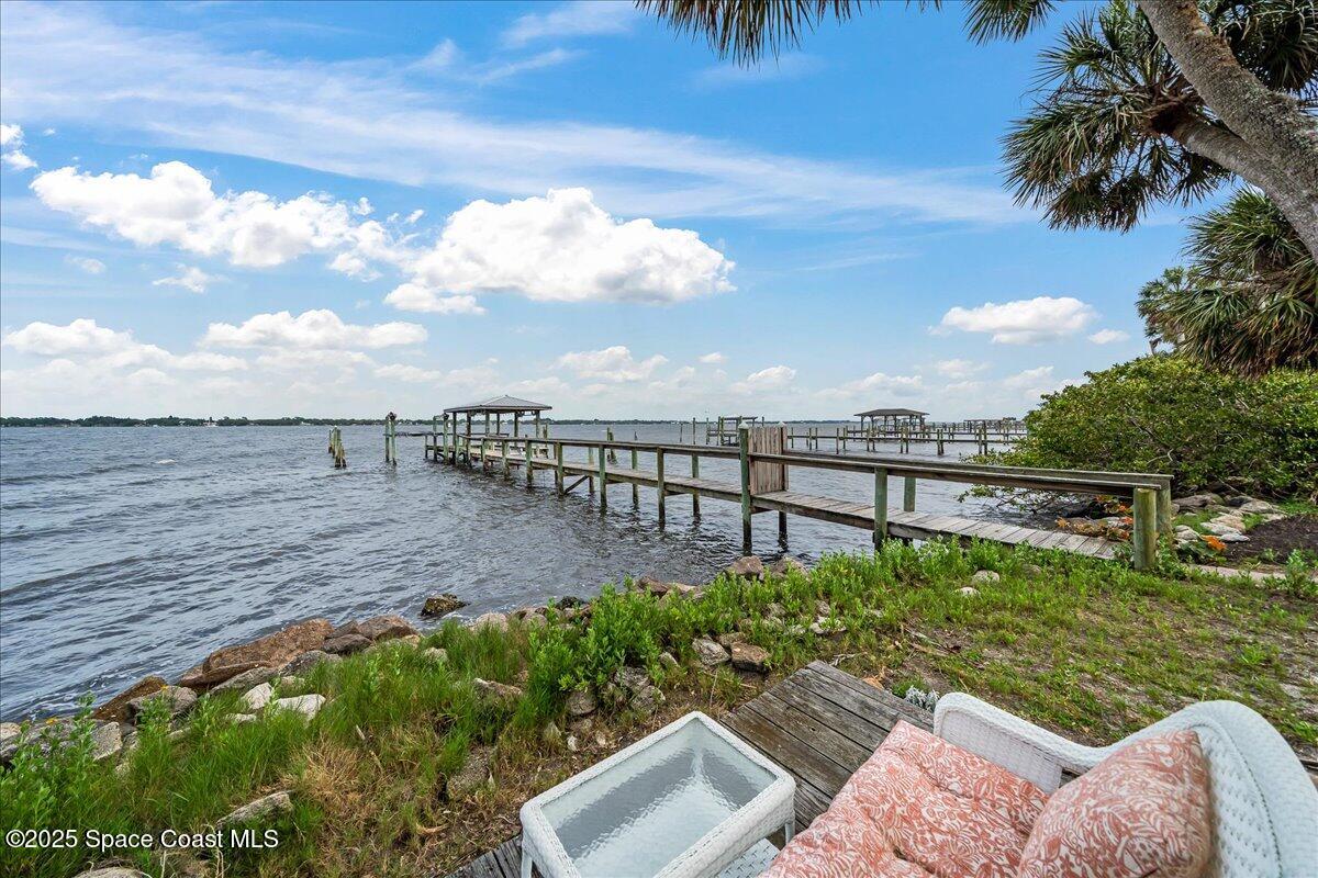 2089 Rockledge Drive Rockledge, FL 32955 - Photo 53 of 60 a view of a backyard with plants and lake view