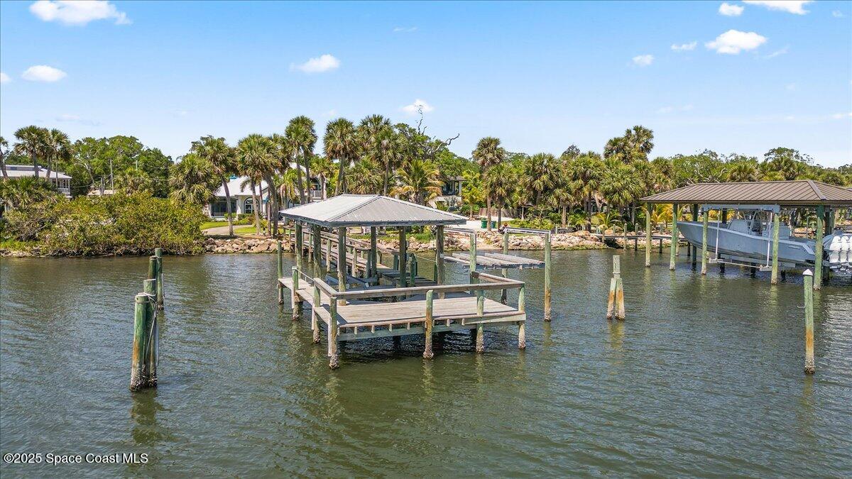 2089 Rockledge Drive Rockledge, FL 32955 - Photo 59 of 60 a view of a lake with a table and chairs