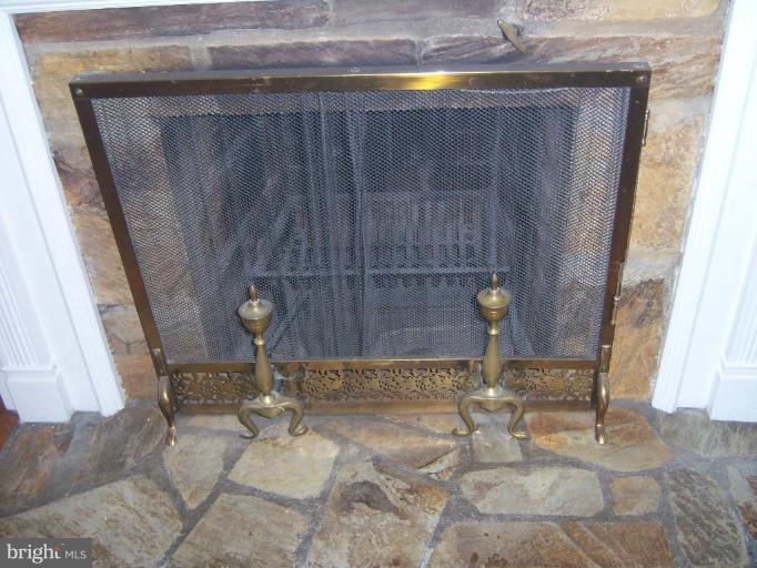 Stone fireplace with beautiful mantel and trim