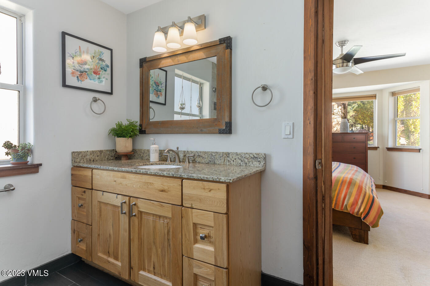 320 Golden Eagle Eagle, CO 81631 - Photo 14 of 26 a en suite bathroom with a granite countertop sink and a mirror