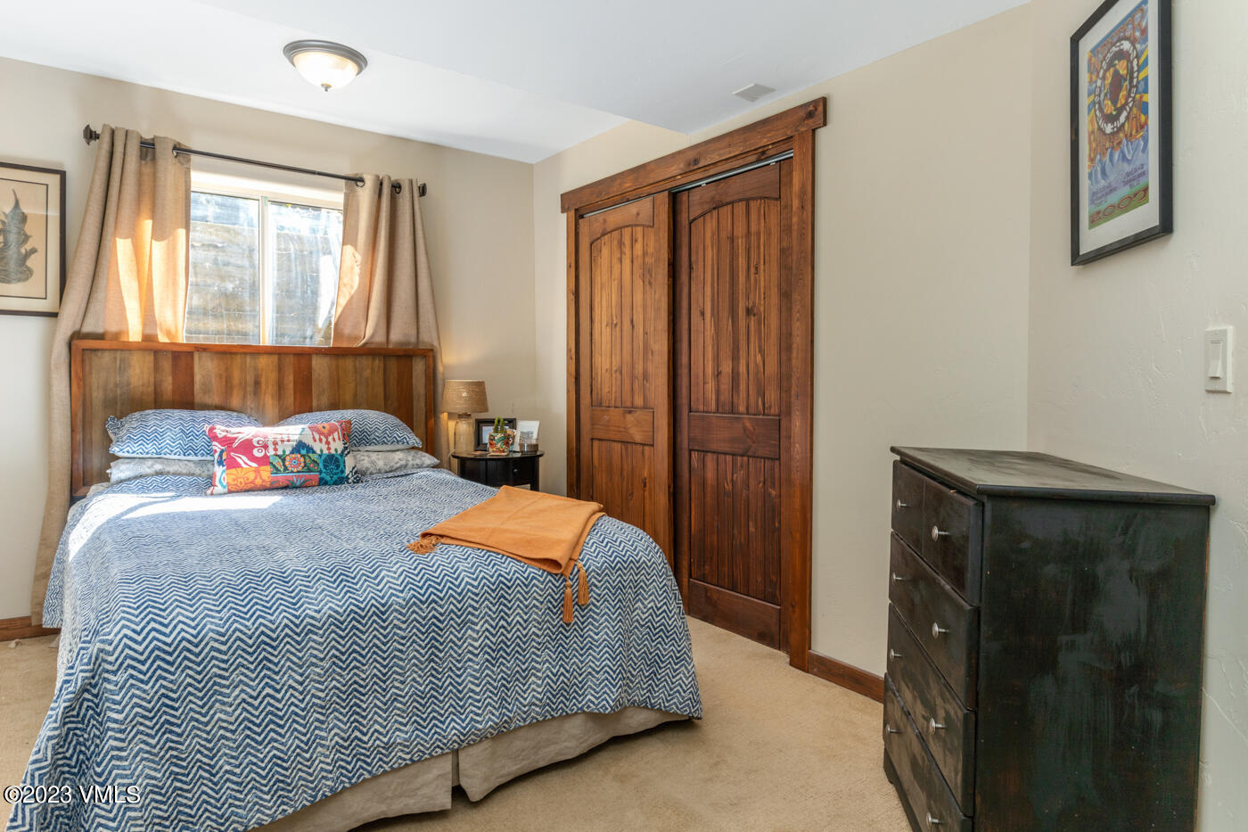 320 Golden Eagle Eagle, CO 81631 - Photo 17 of 26 a bedroom with a bed and wooden floor