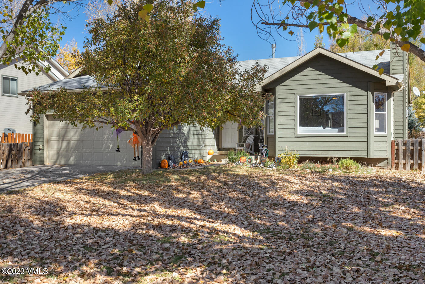 320 Golden Eagle Eagle, CO 81631 - Photo 22 of 26 a front view of a house with a yard and garage