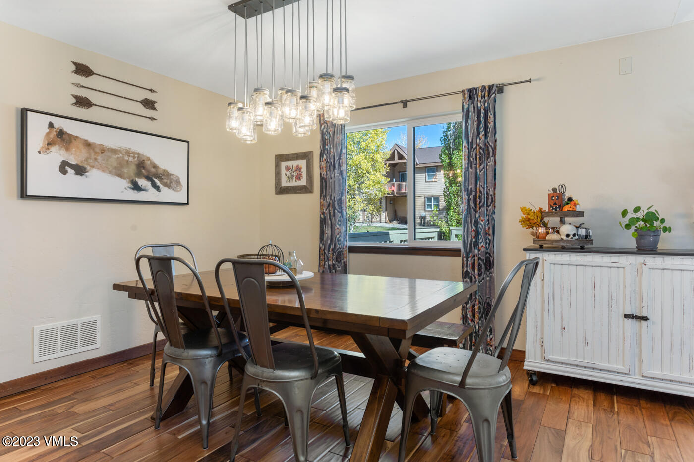 320 Golden Eagle Eagle, CO 81631 - Photo 5 of 26 a view of a dining room with furniture window and wooden floor