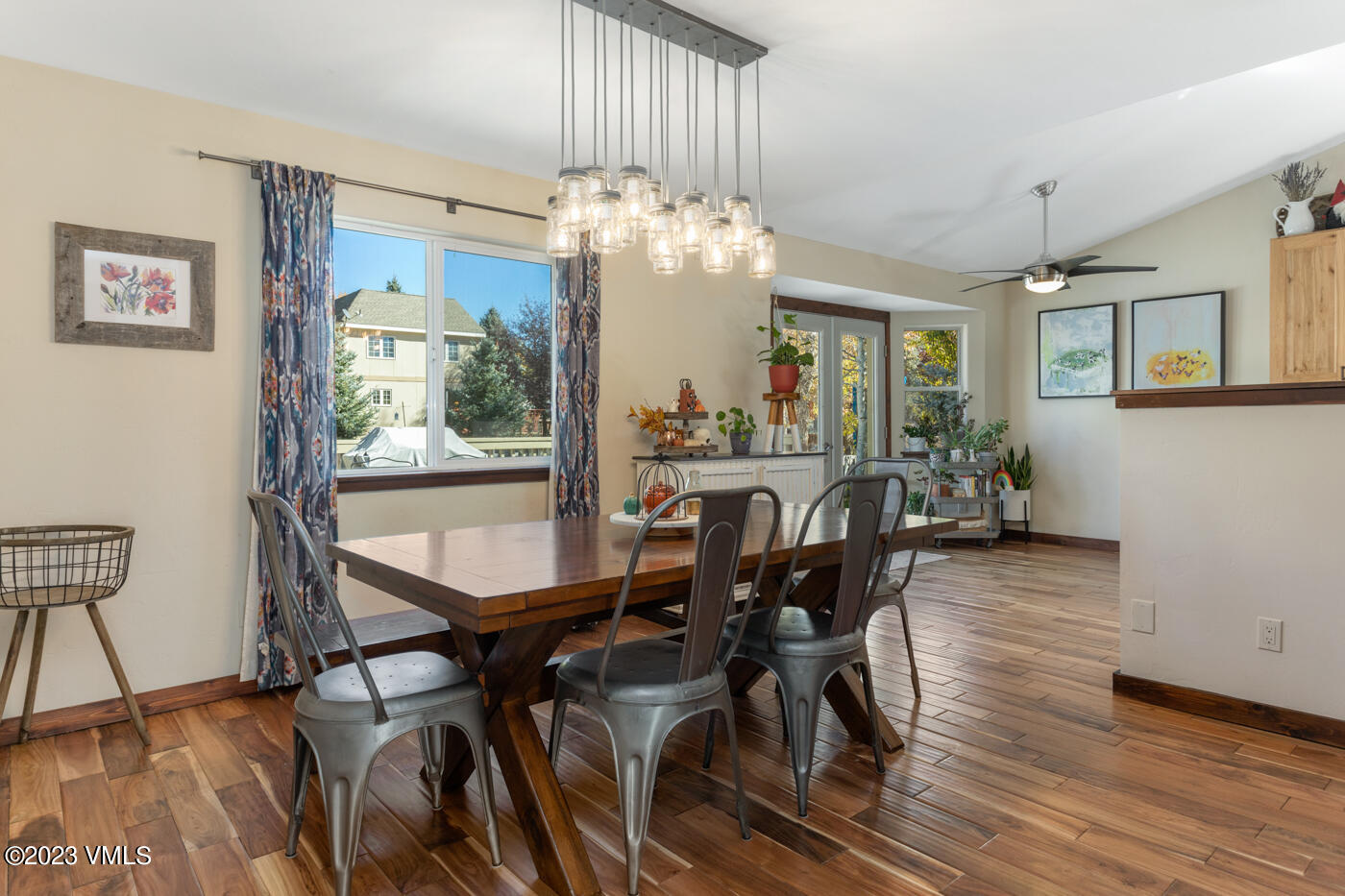 320 Golden Eagle Eagle, CO 81631 - Photo 7 of 26 a view of a dining room with furniture window and wooden floor