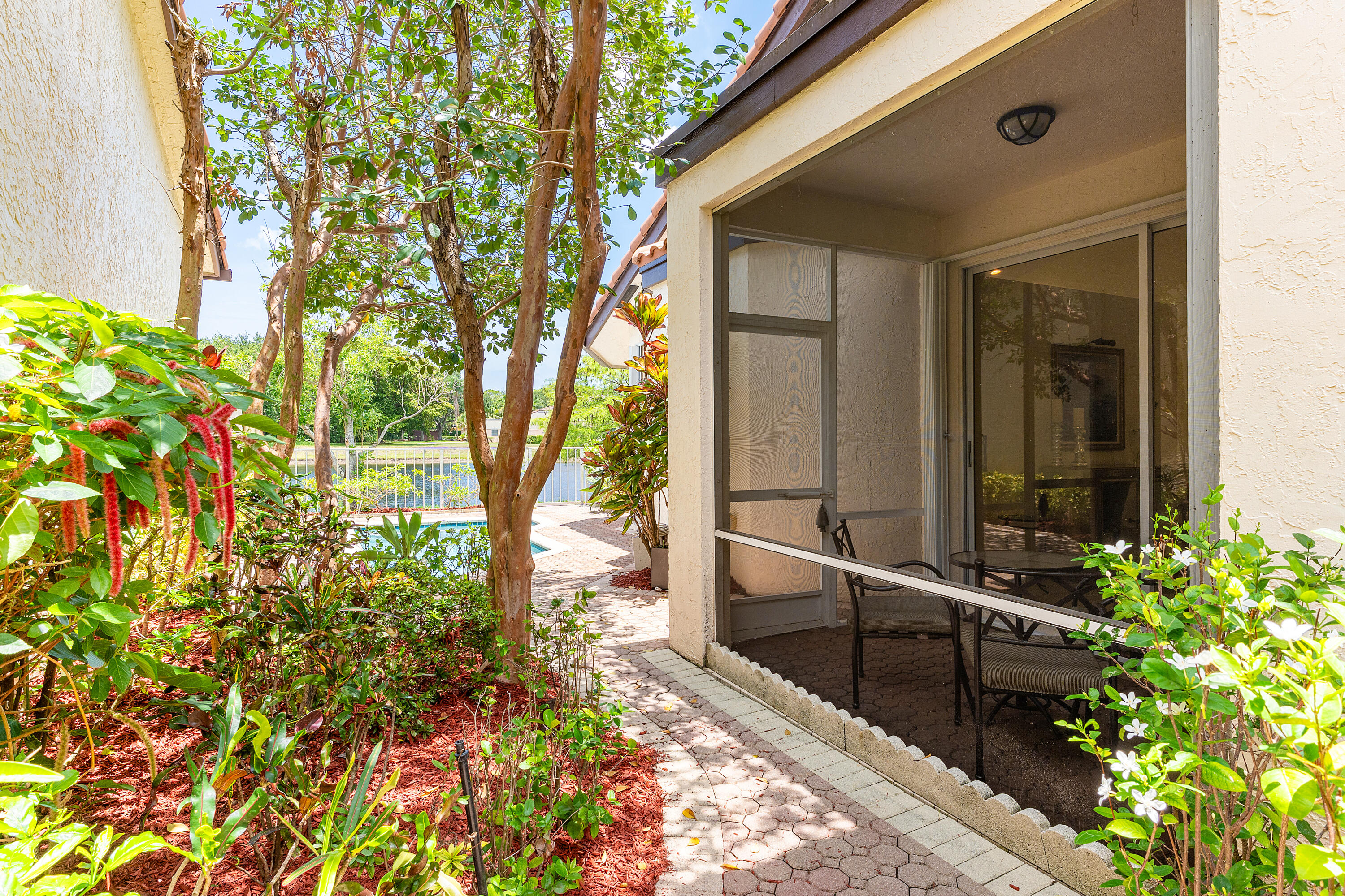 23193 Via Stel Boca Raton, FL 33433 - Photo 34 of 38 Side Yard + Patio