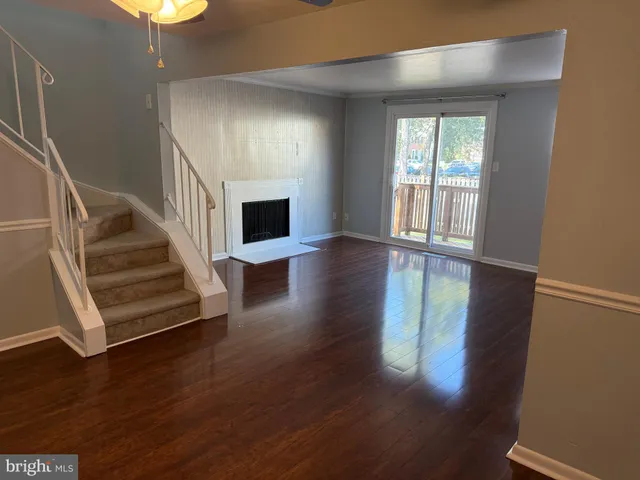 a view of an entryway with wooden floor