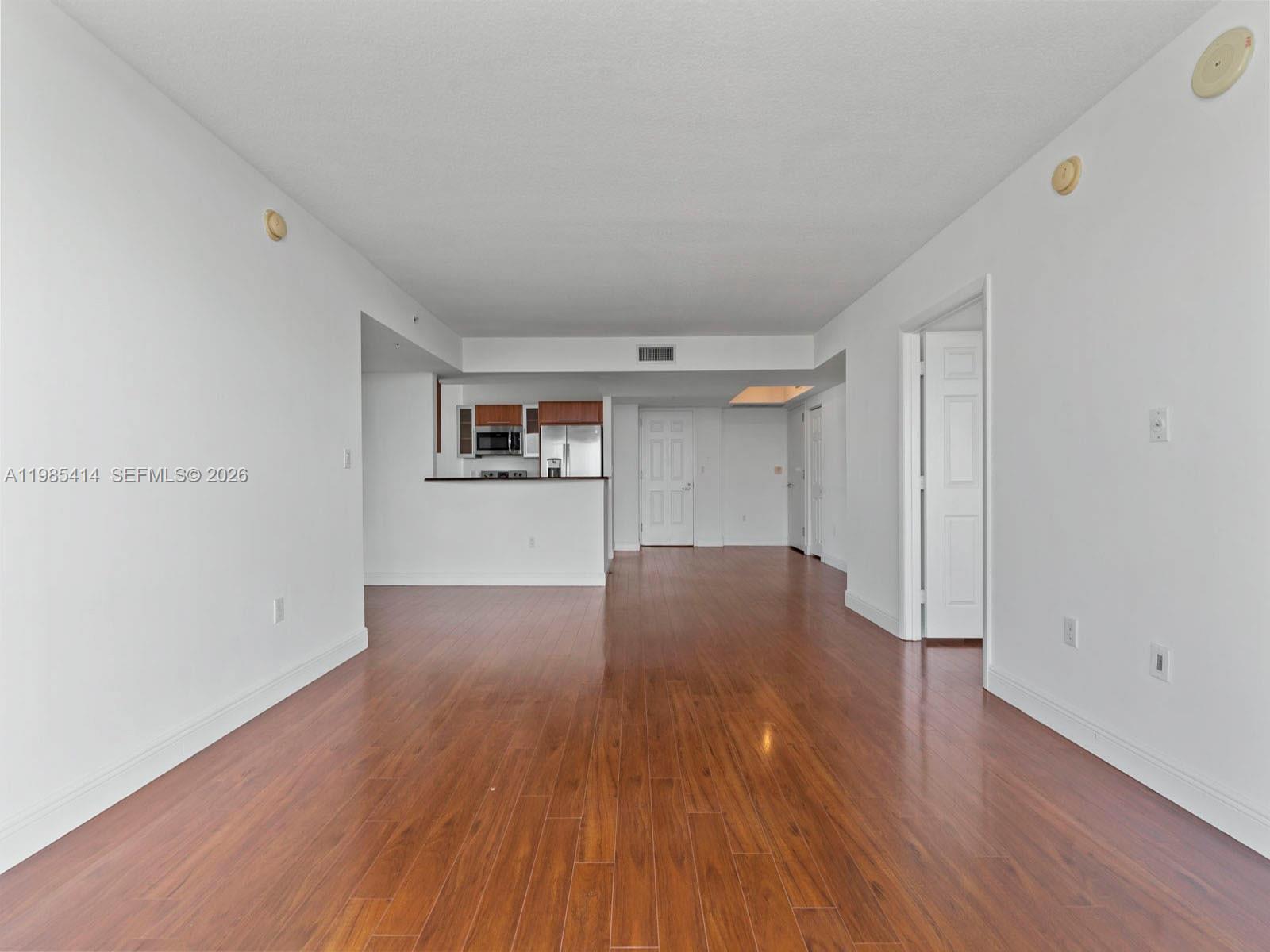 3232 Southwest 22nd Terrace, Unit 1609 Miami, FL 33145 - Photo 11 of 37 a view of empty room with wooden floor