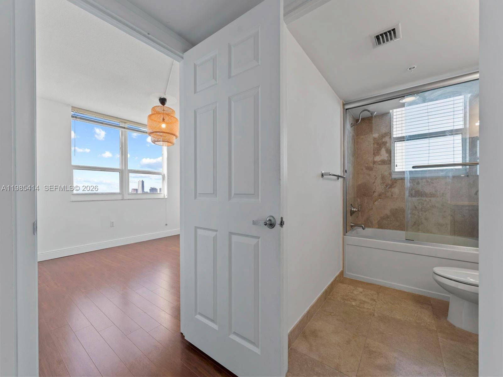 3232 Southwest 22nd Terrace, Unit 1609 Miami, FL 33145 - Photo 13 of 37 a view of an empty room and window