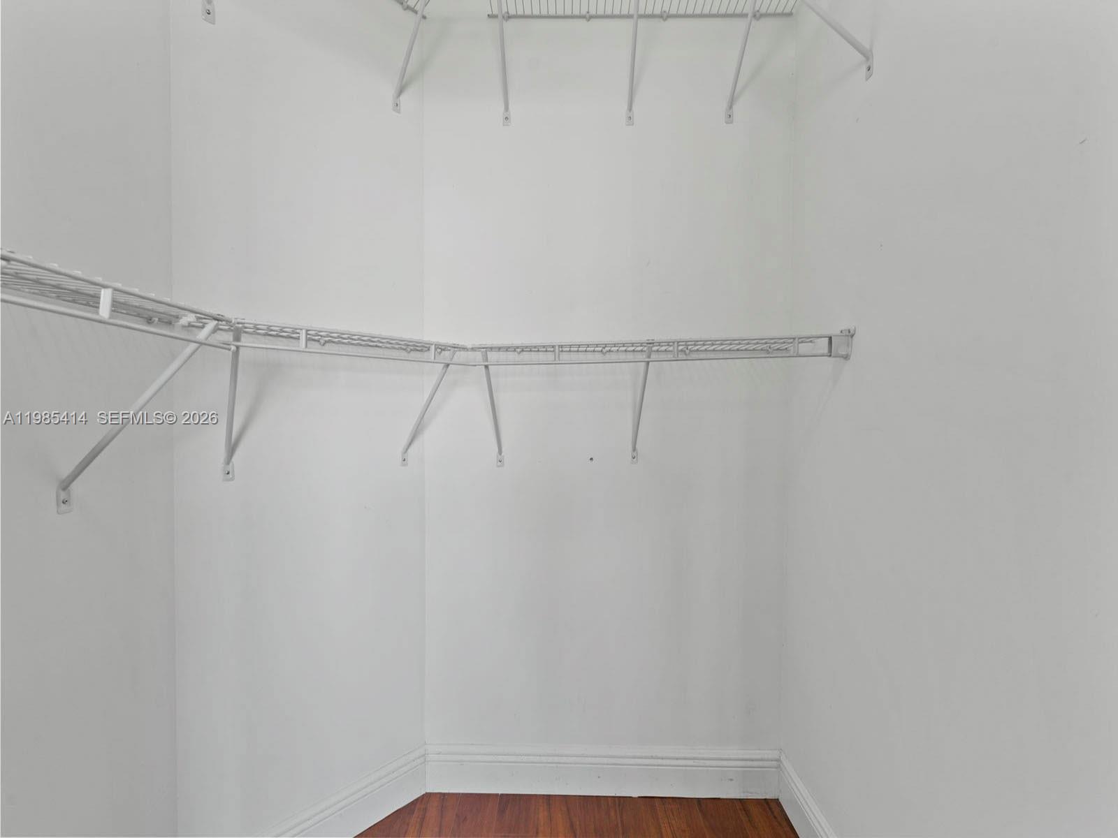 3232 Southwest 22nd Terrace, Unit 1609 Miami, FL 33145 - Photo 22 of 37 a view of a room with racks on the wall