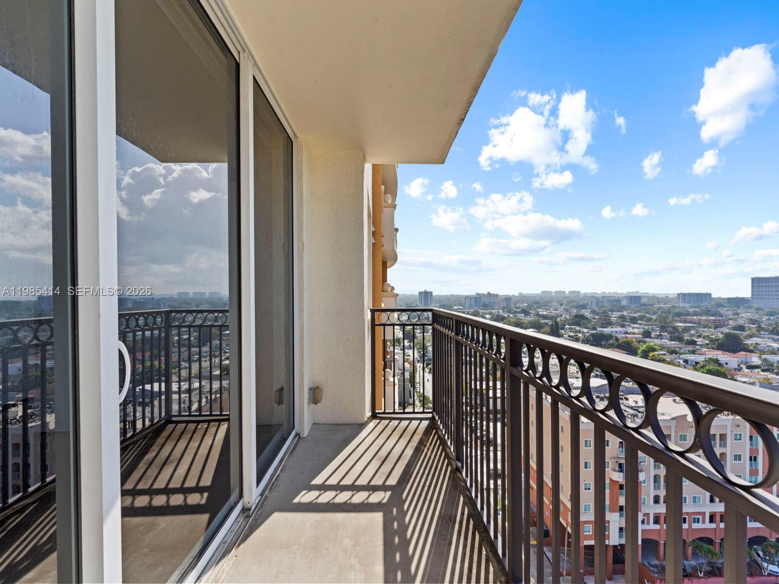 3232 Southwest 22nd Terrace, Unit 1609 Miami, FL 33145 - Photo 25 of 37 a view of a balcony with wooden floor