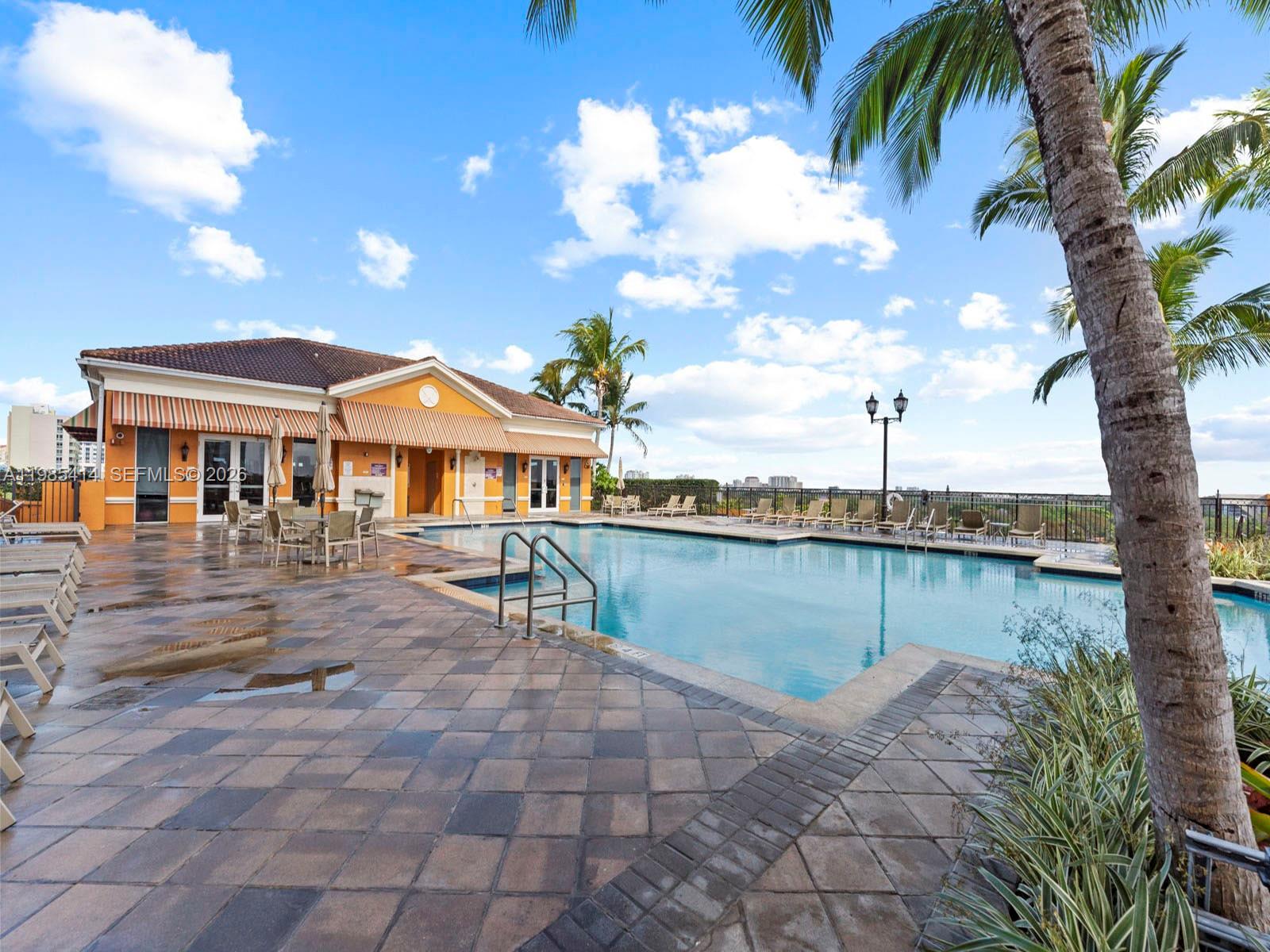 3232 Southwest 22nd Terrace, Unit 1609 Miami, FL 33145 - Photo 36 of 37 a view of a chairs and table on the terrace
