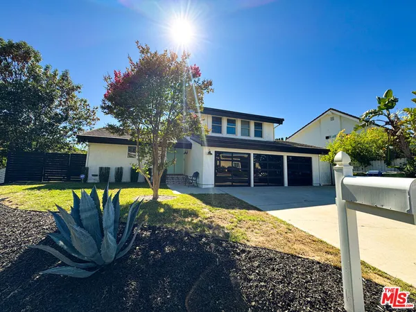 a view of a house with swimming pool and porch with furniture