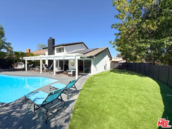 a front view of a house with swimming pool