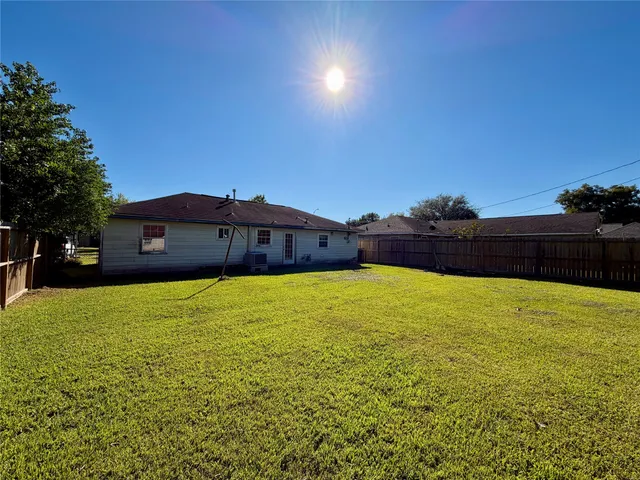 a house view with a big yard