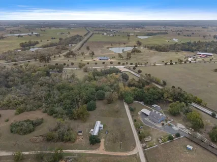 an aerial view of residential building and ocean view