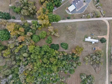 an aerial view of mountains with green space