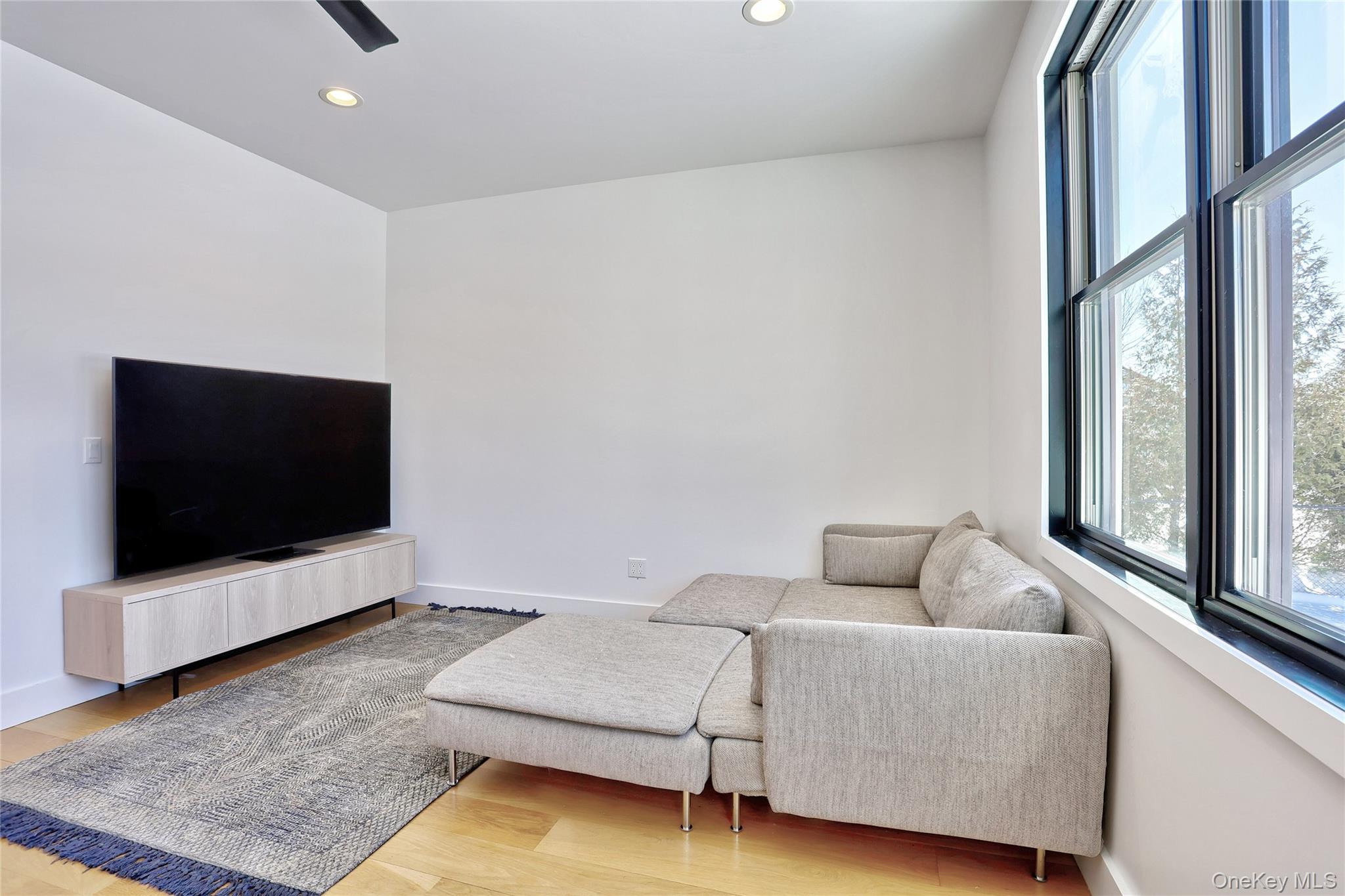 37 Harvest Road New City, NY 10956 - Photo 15 of 35 a living room with furniture and a flat screen tv