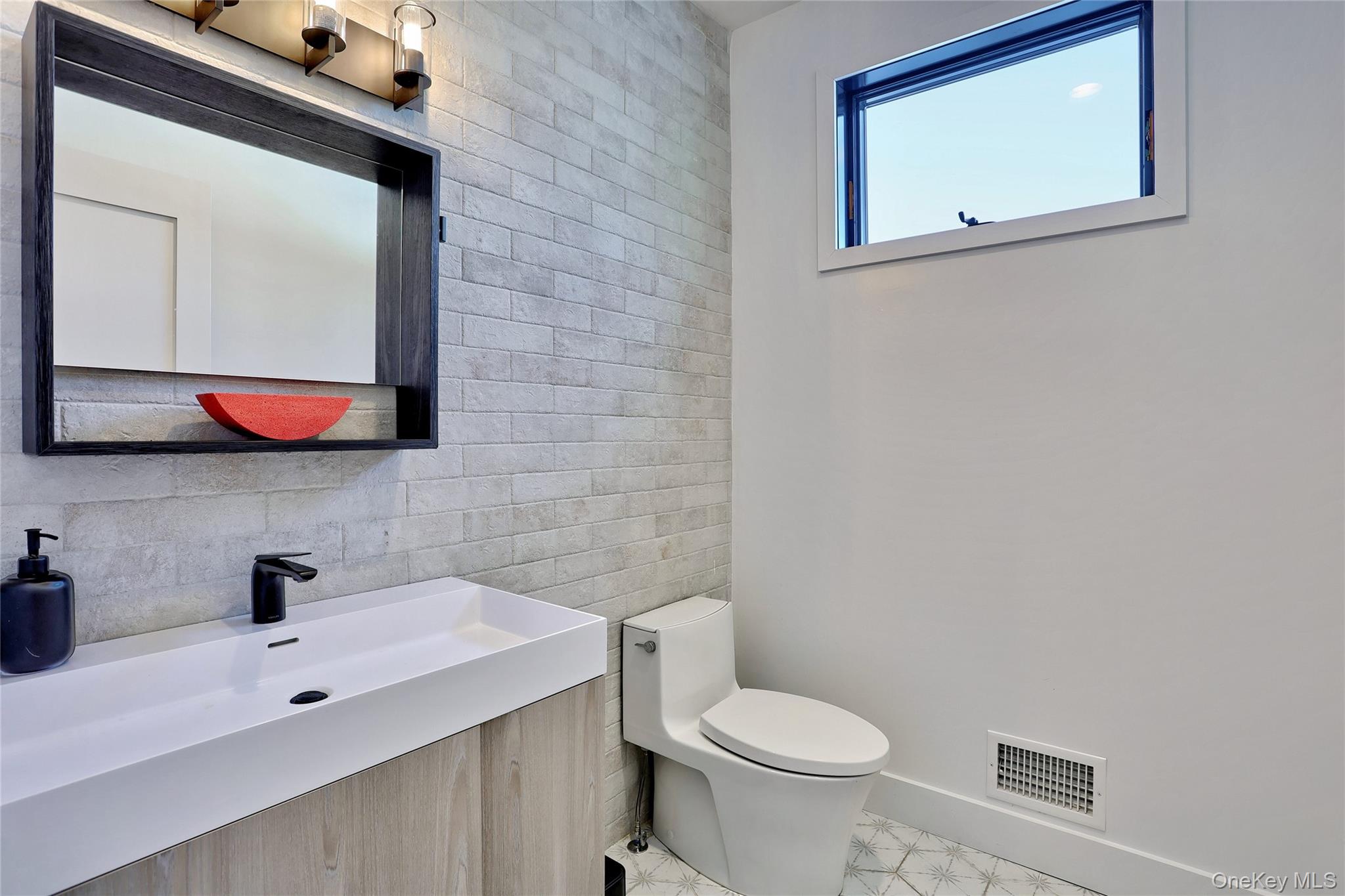 37 Harvest Road New City, NY 10956 - Photo 16 of 33 a bathroom with a toilet sink and mirror
