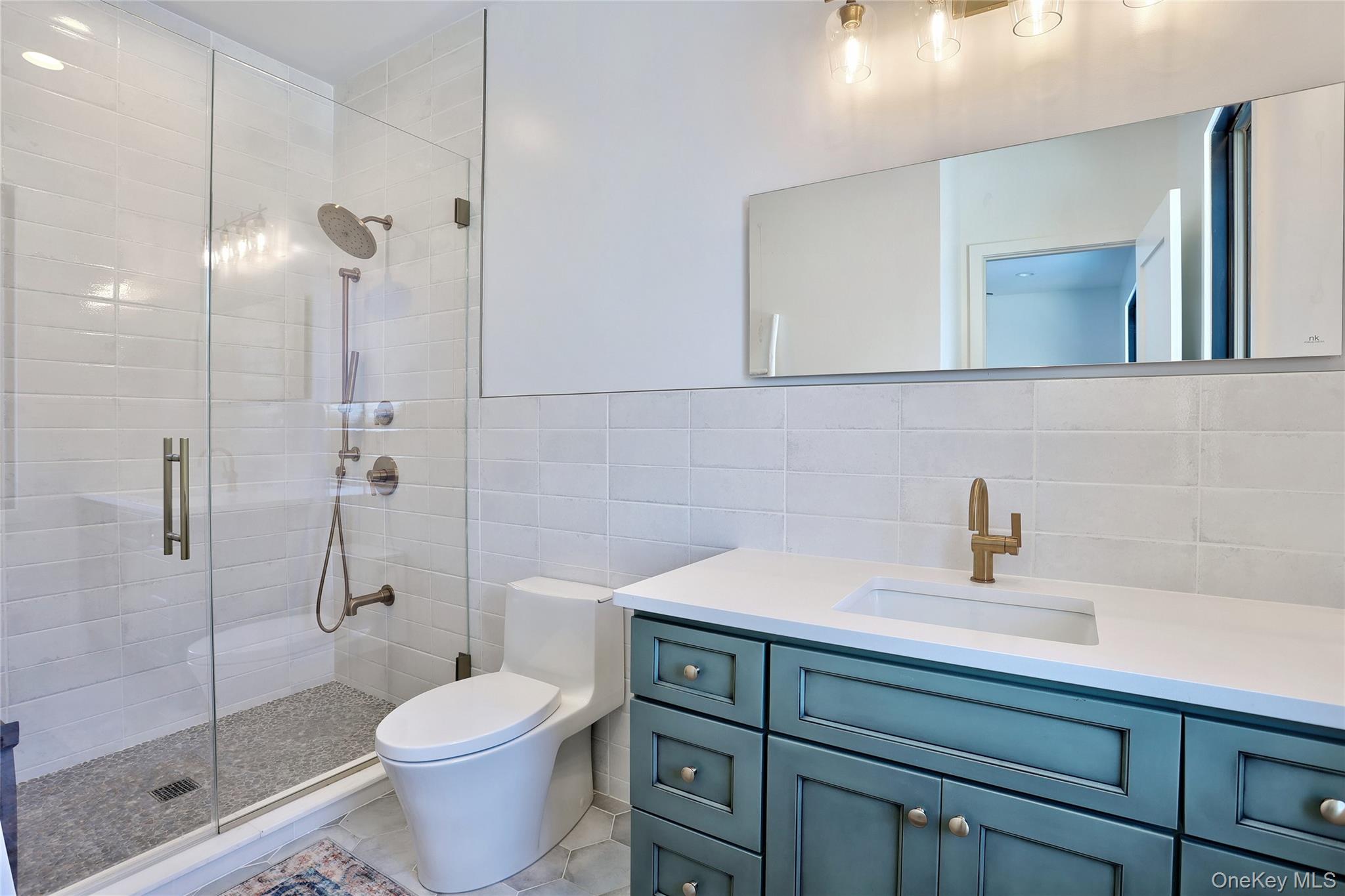 37 Harvest Road New City, NY 10956 - Photo 24 of 33 a bathroom with a sink toilet and shower