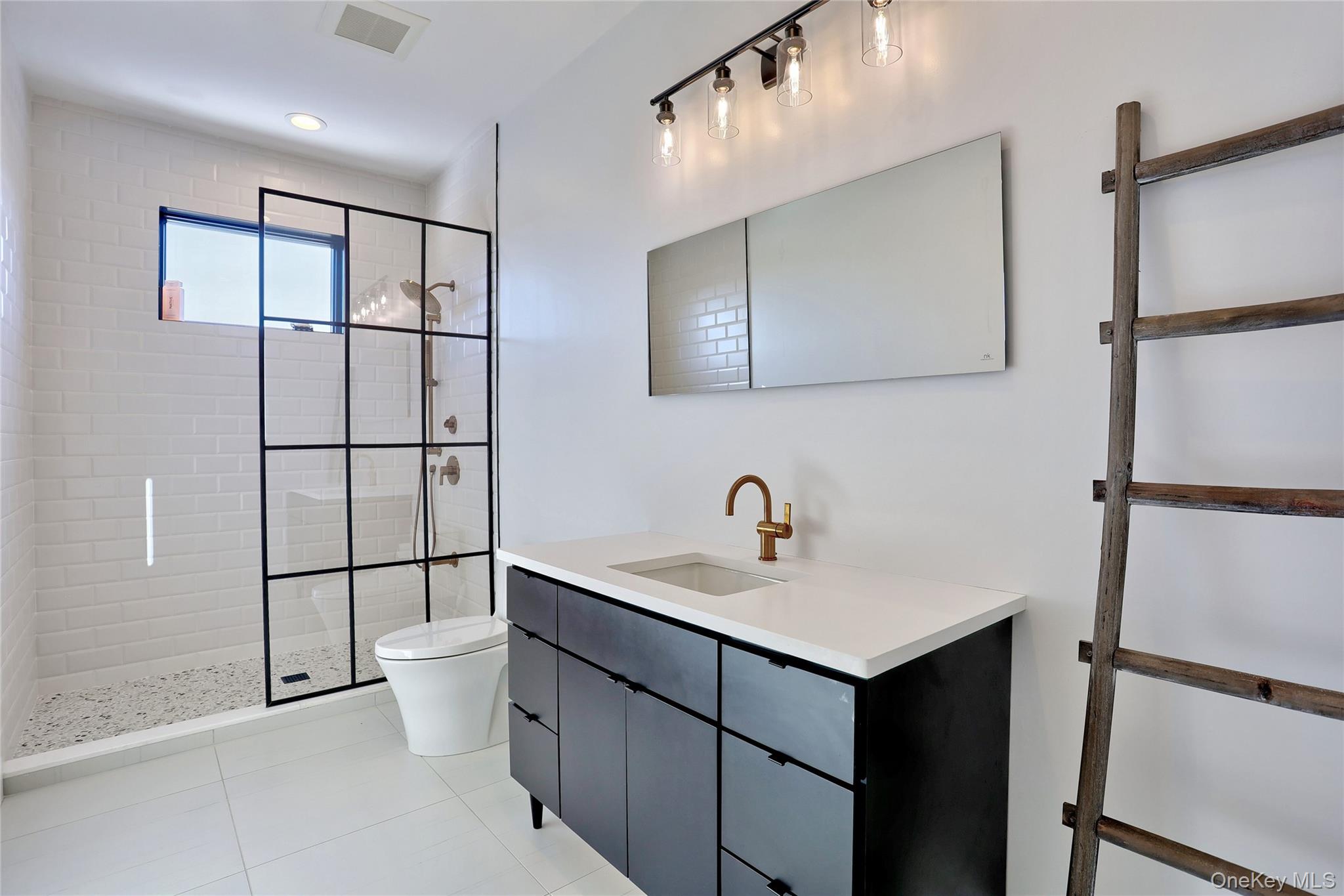 37 Harvest Road New City, NY 10956 - Photo 29 of 35 a bathroom with a sink and a mirror