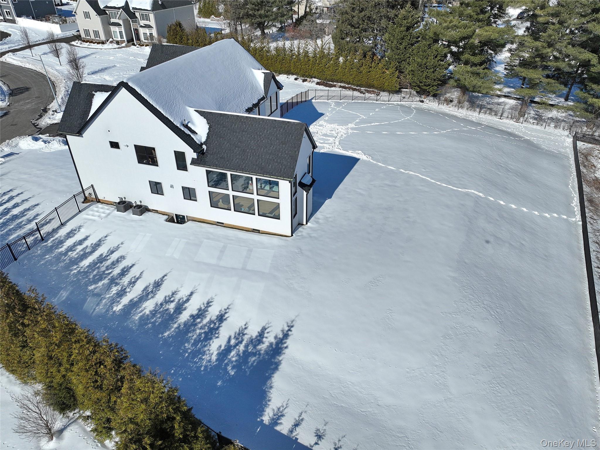 37 Harvest Road New City, NY 10956 - Photo 31 of 35 an aerial view of a house with a yard and sitting area