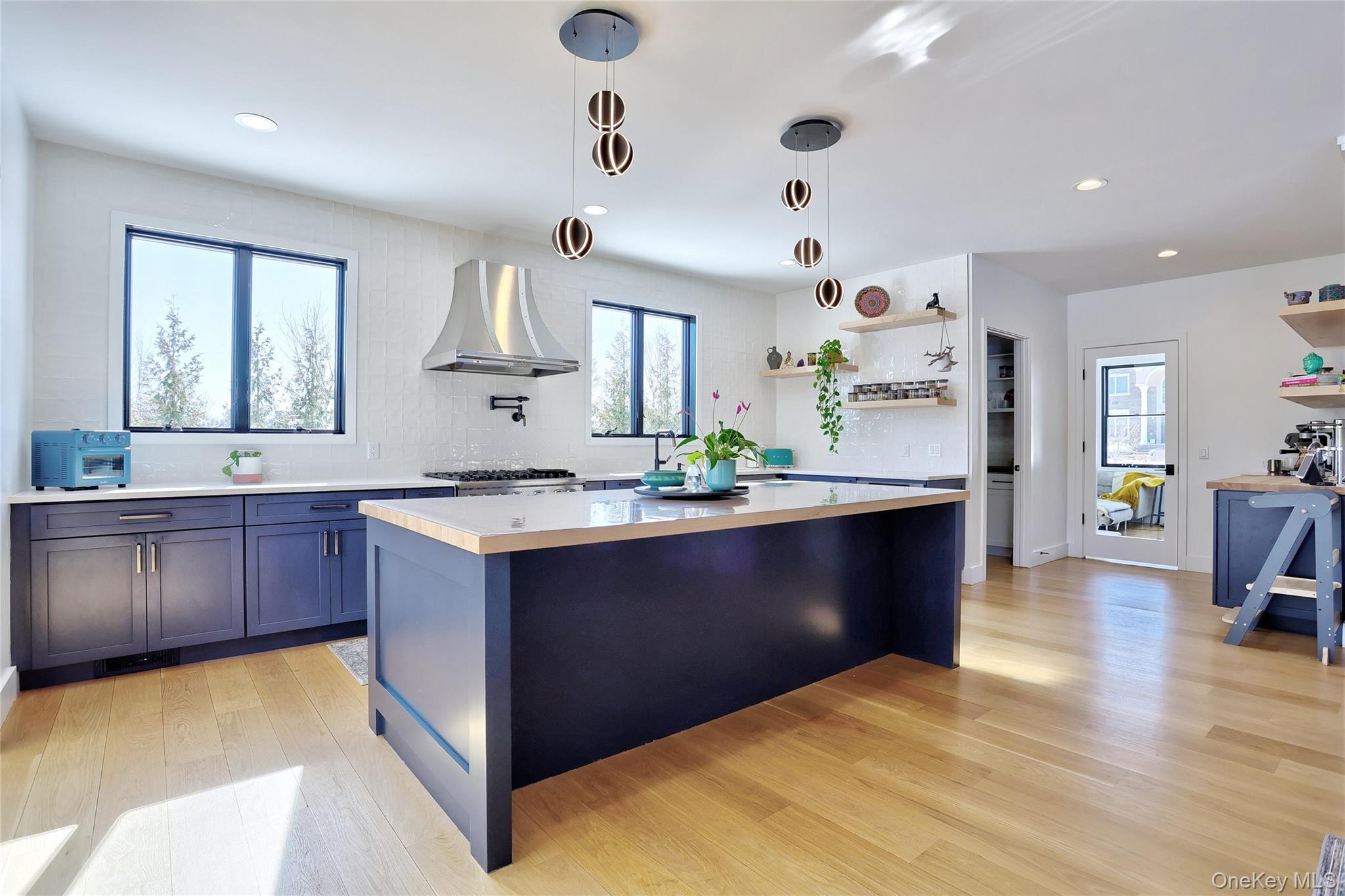 37 Harvest Road New City, NY 10956 - Photo 9 of 35 a kitchen with stainless steel appliances granite countertop a sink a stove and a wooden floors