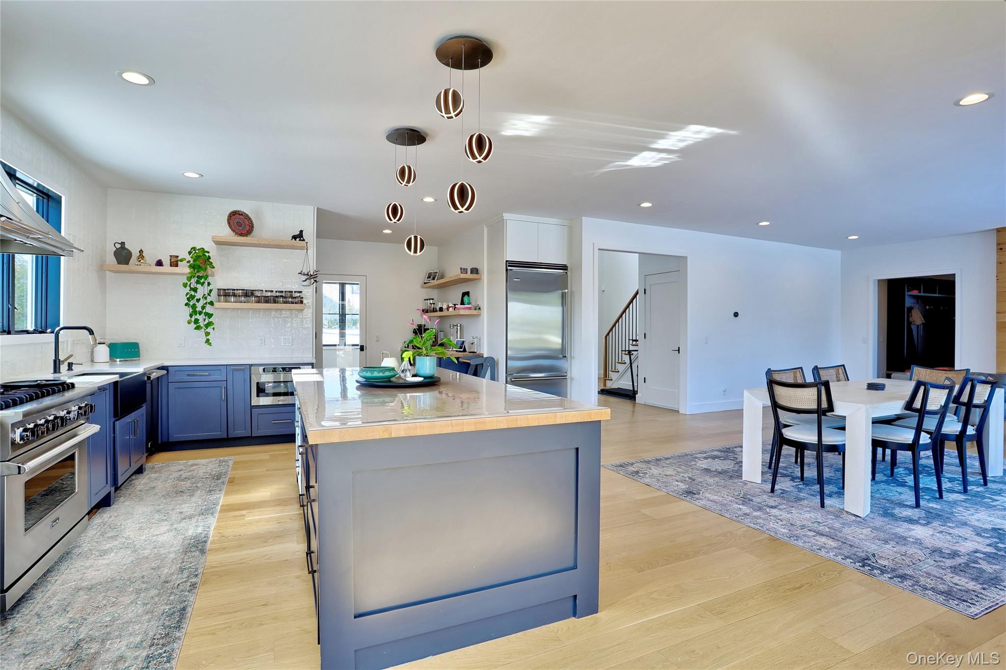 37 Harvest Road New City, NY 10956 - Photo 10 of 35 a kitchen with stainless steel appliances kitchen island granite countertop a table chairs and a refrigerator