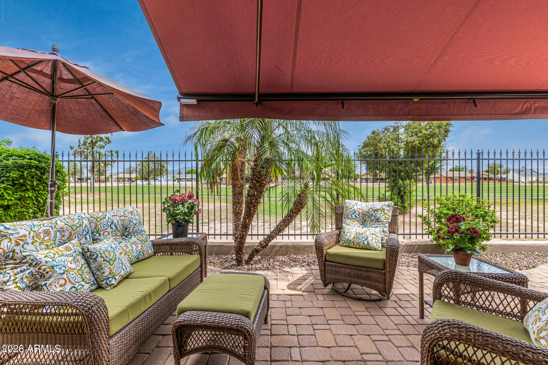 6202 East McKellips Road, Unit 297 Mesa, AZ 85215 - Photo 1 of 57 a balcony with furniture and umbrella