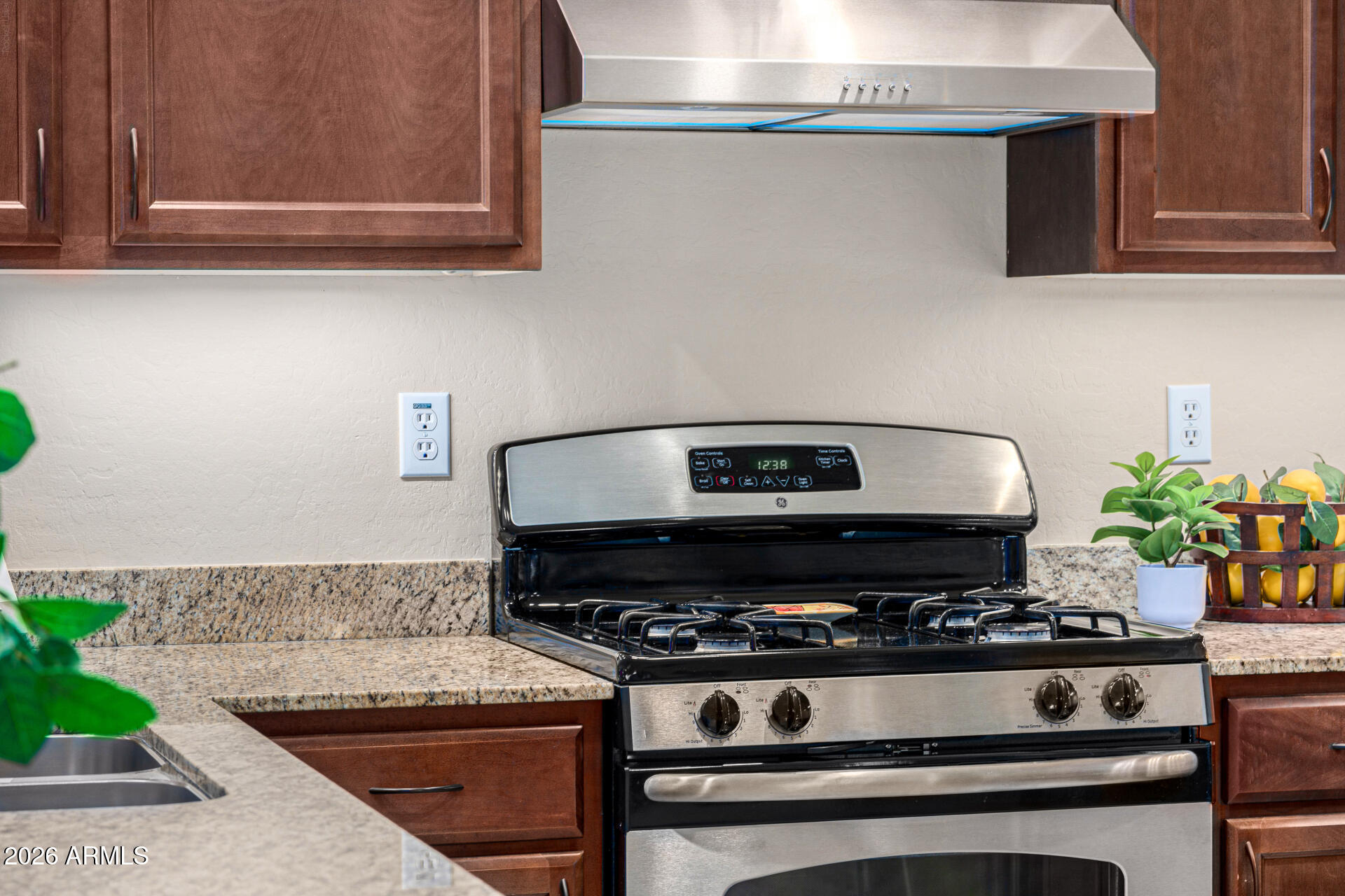 6202 East McKellips Road, Unit 297 Mesa, AZ 85215 - Photo 15 of 57 a stove top oven sitting inside of a kitchen