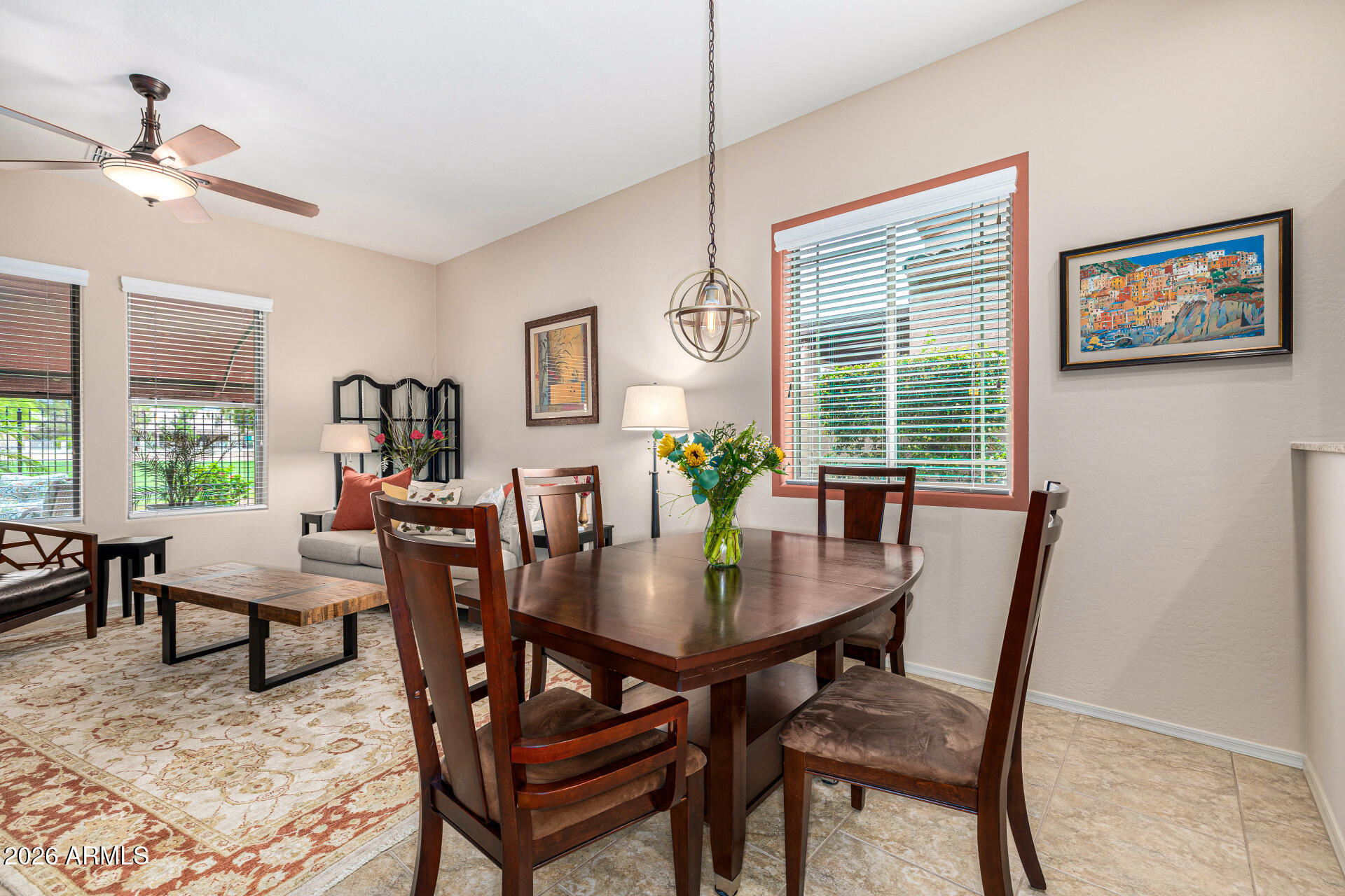 6202 East McKellips Road, Unit 297 Mesa, AZ 85215 - Photo 16 of 57 a view of a dining room with furniture window and wooden floor