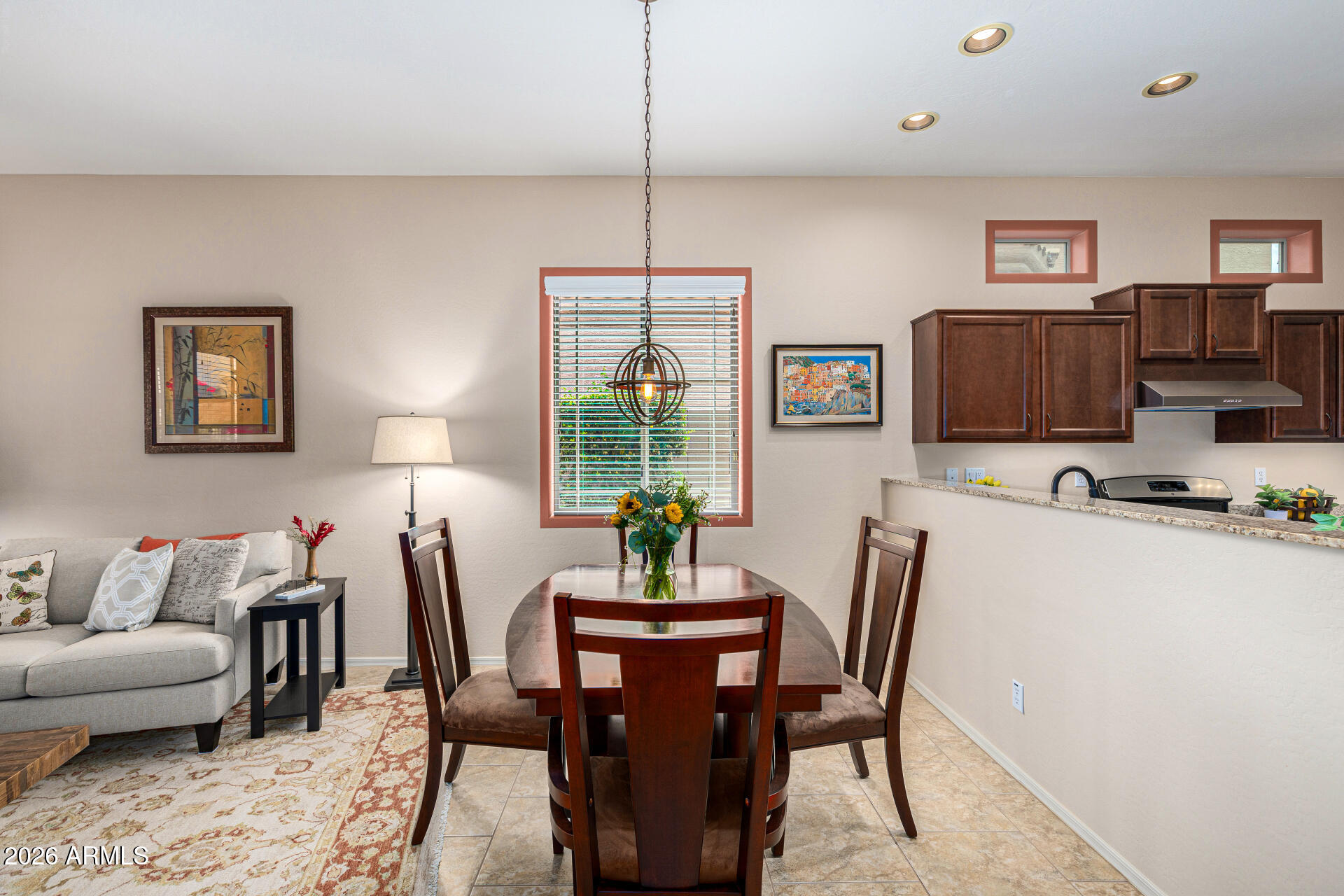 6202 East McKellips Road, Unit 297 Mesa, AZ 85215 - Photo 17 of 57 a dining room with furniture and window