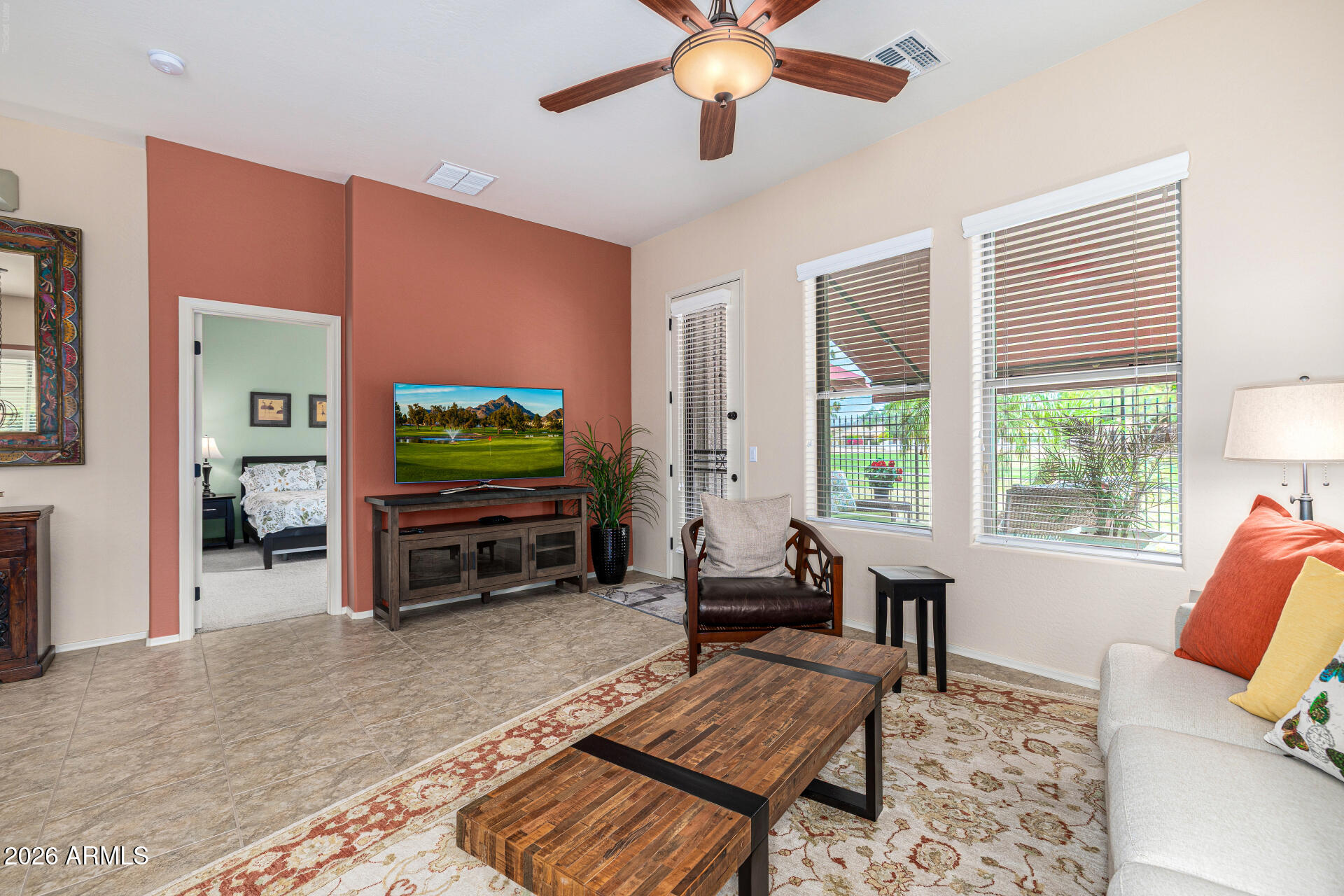 6202 East McKellips Road, Unit 297 Mesa, AZ 85215 - Photo 23 of 57 a living room with furniture and a flat screen tv