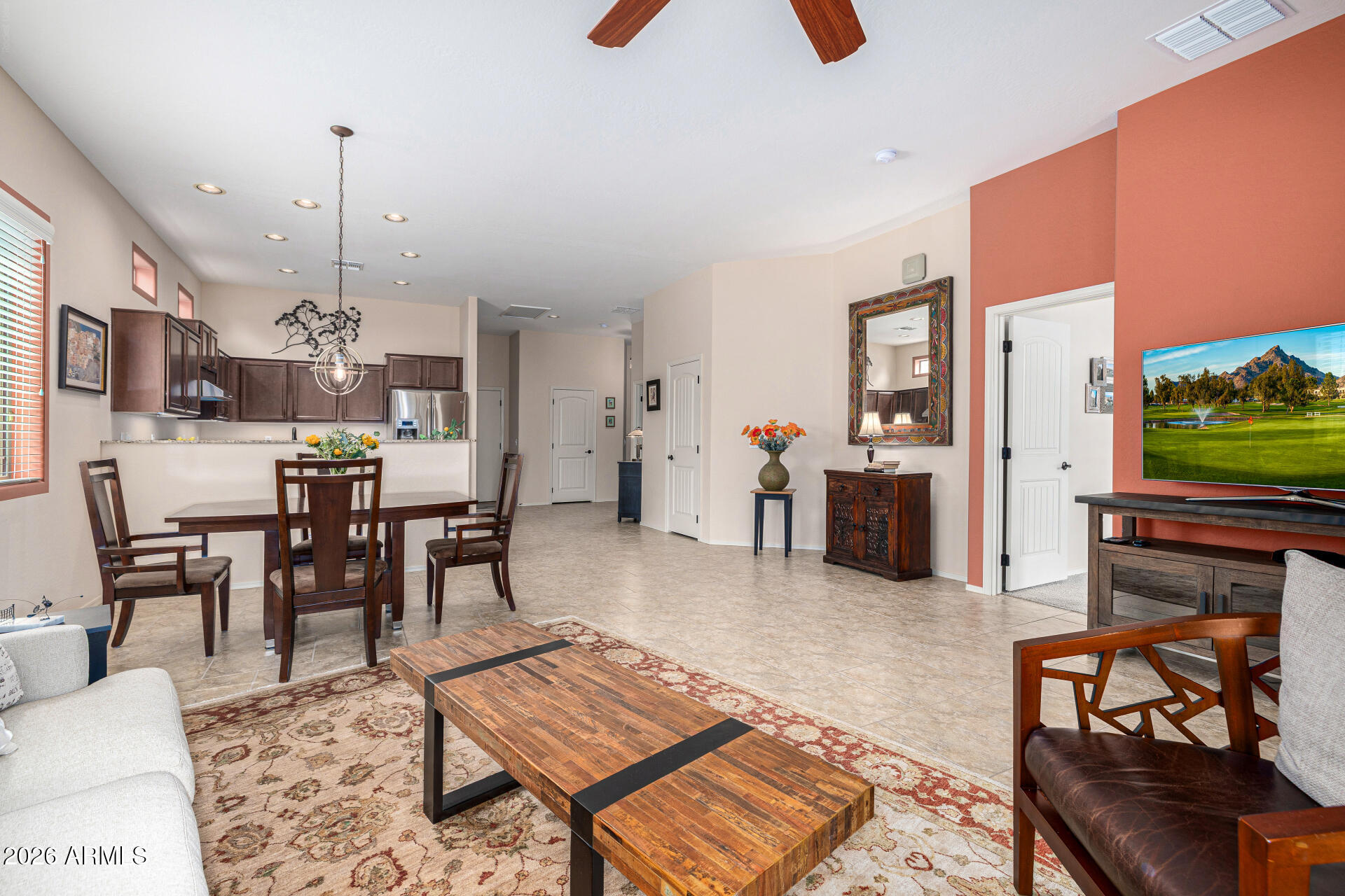 6202 East McKellips Road, Unit 297 Mesa, AZ 85215 - Photo 24 of 57 a living room with furniture and a flat screen tv