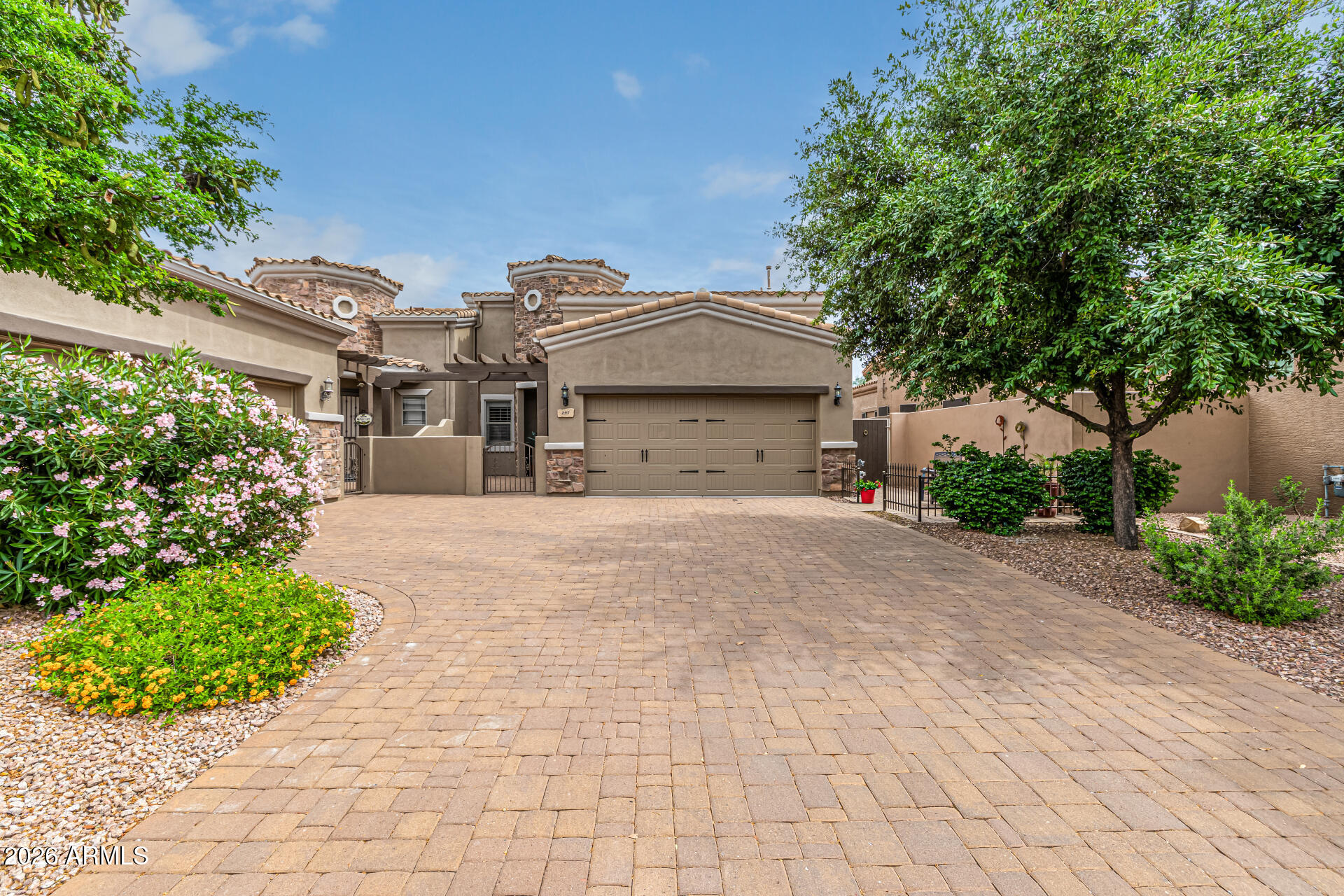 6202 East McKellips Road, Unit 297 Mesa, AZ 85215 - Photo 2 of 57 a front view of a house with garden