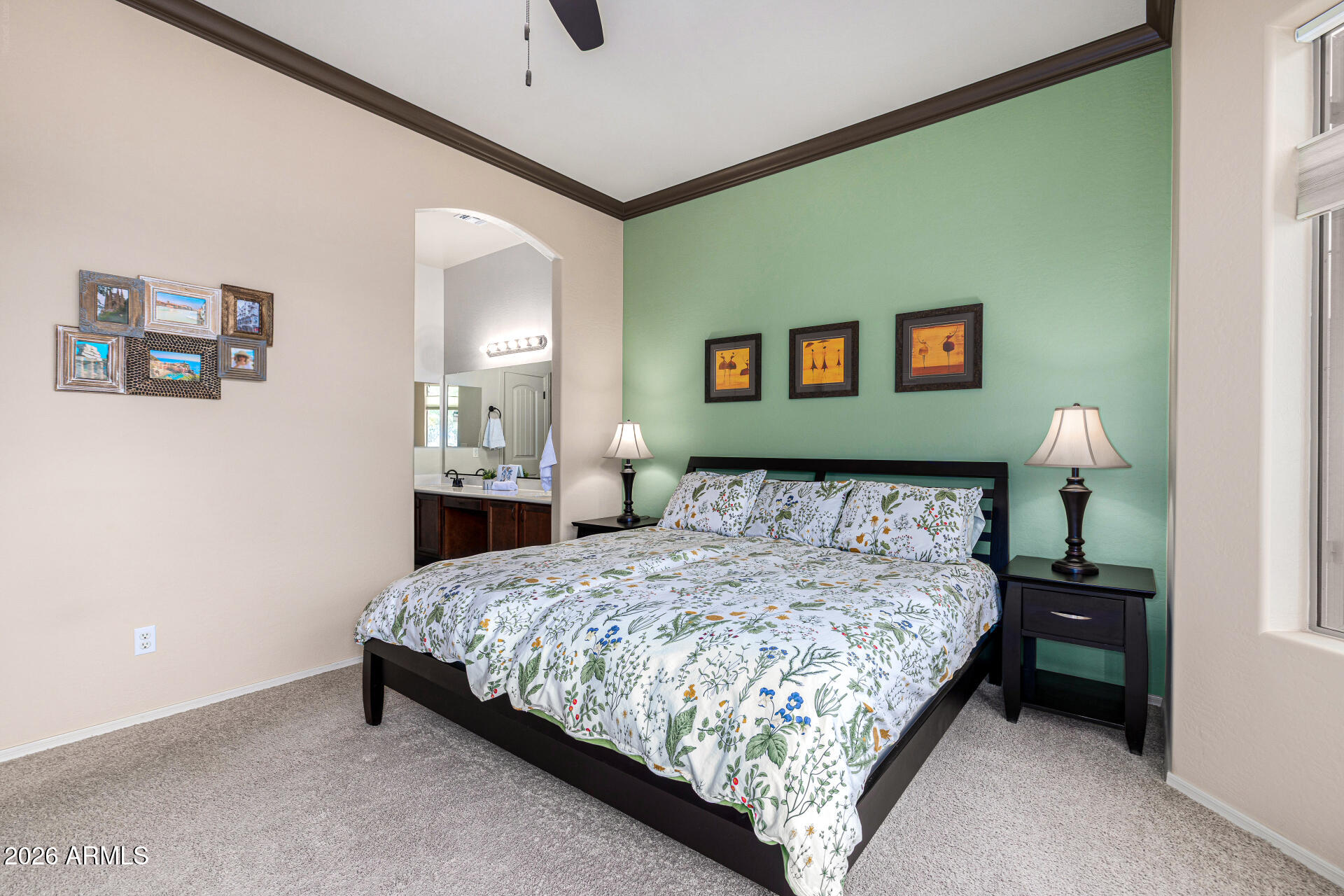 6202 East McKellips Road, Unit 297 Mesa, AZ 85215 - Photo 28 of 57 a bedroom with a bed and painting on the wall
