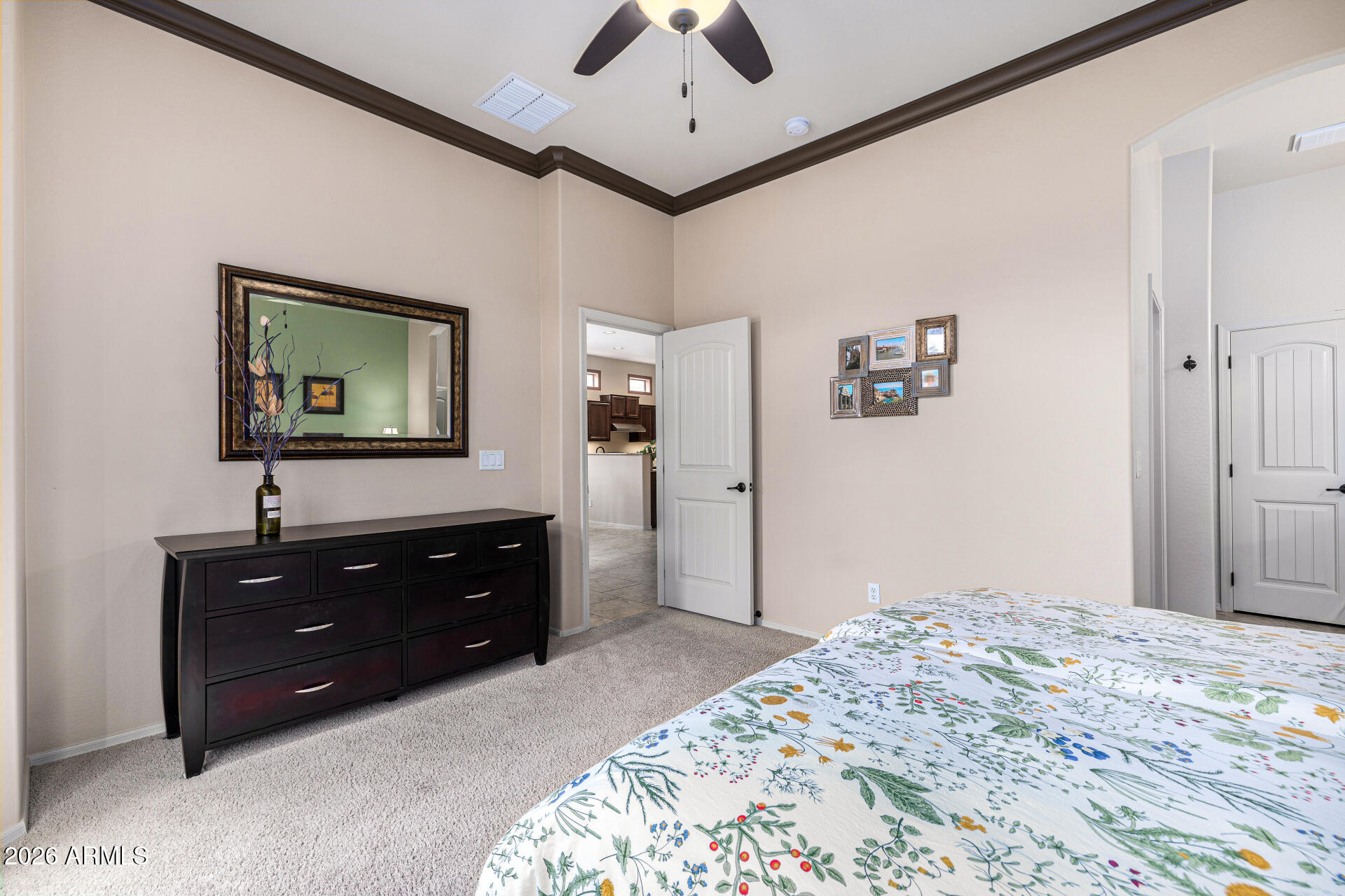 6202 East McKellips Road, Unit 297 Mesa, AZ 85215 - Photo 57 of 57 a bedroom with a bed and a dresser