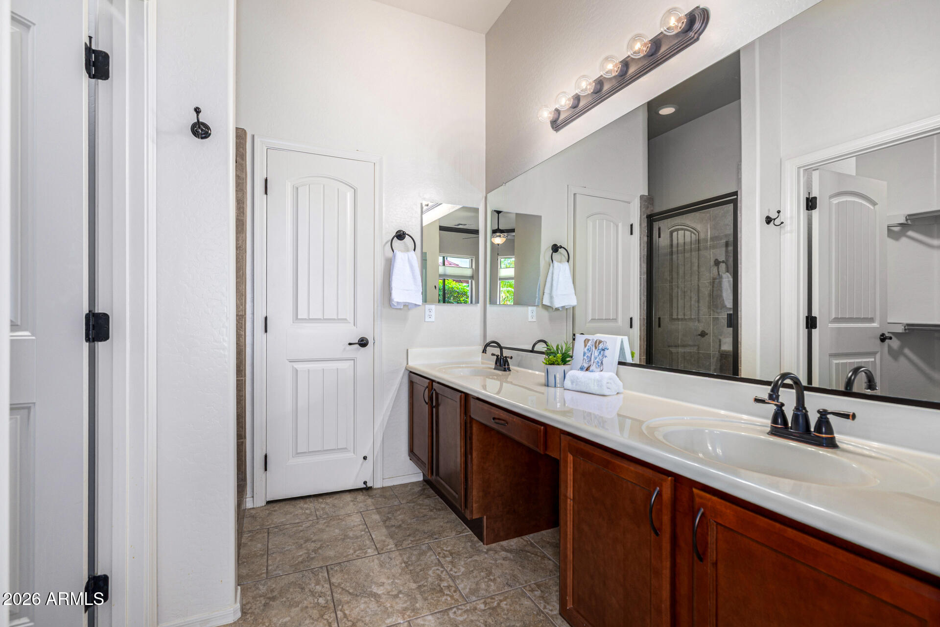 6202 East McKellips Road, Unit 297 Mesa, AZ 85215 - Photo 30 of 57 a bathroom with a double vanity sink and a mirror
