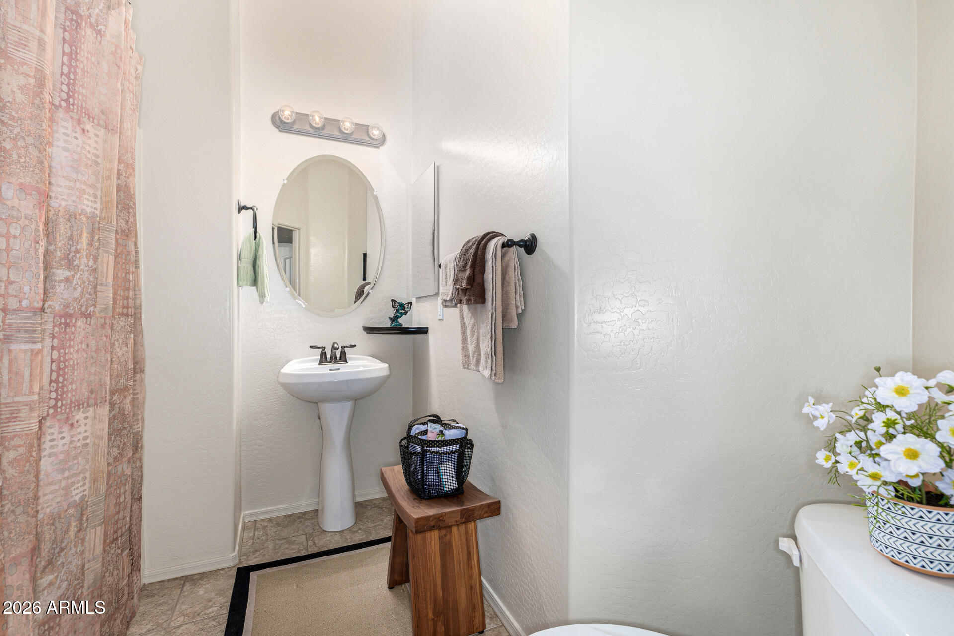 6202 East McKellips Road, Unit 297 Mesa, AZ 85215 - Photo 37 of 57 a bathroom with a sink mirror and toilet